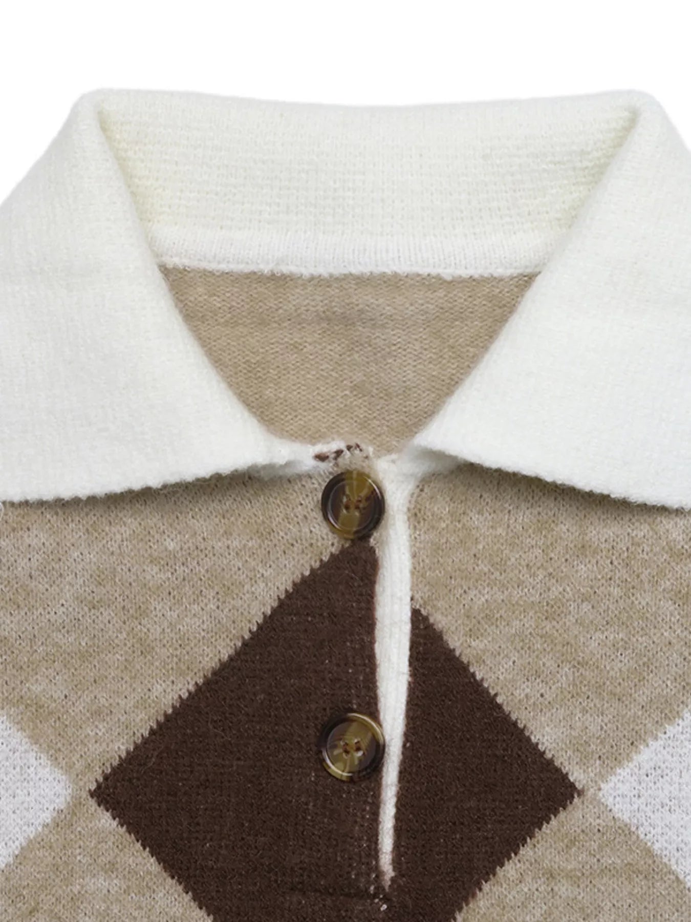 Close-up of the white polo collar and tortoiseshell buttons on the argyle sweater