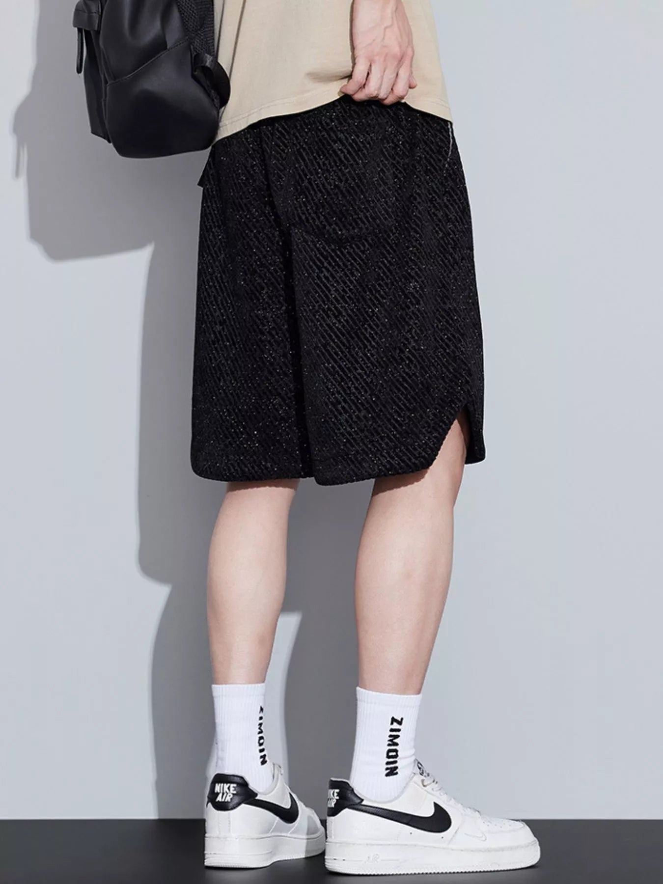 Men's loose fit shorts with a drawstring waist and pockets.