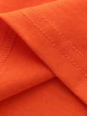 Close view of the double stitched fabric detail on the orange red children's t-shirt