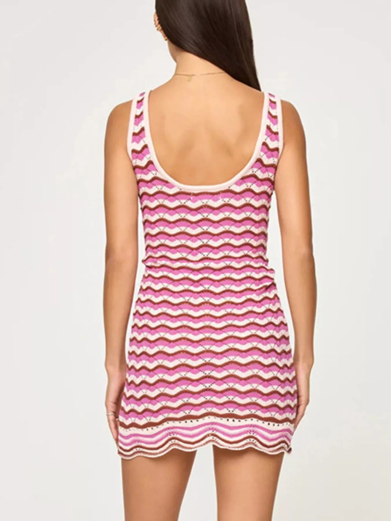 Back view of a pink, cream and brown openwork chevron knit tank dress with a scoop back