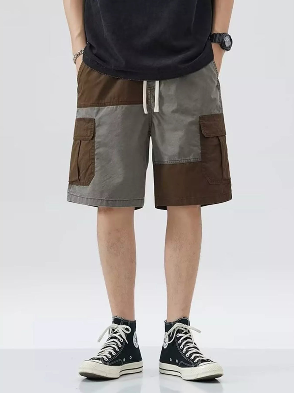 Men's gray two-tone cargo shorts with a drawstring waist and pockets.