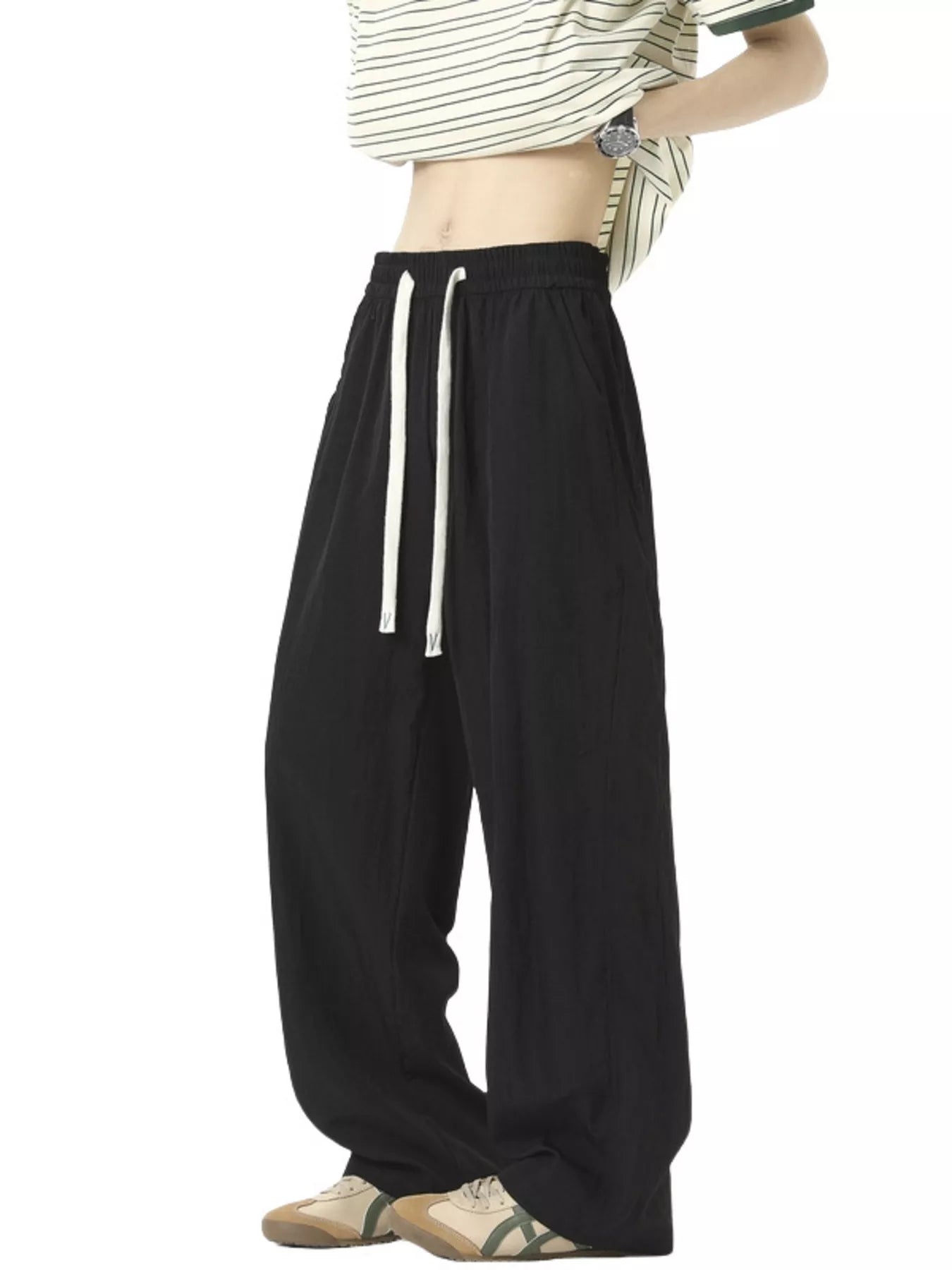 Men's lightweight loose fit casual pants with a drawstring waist.