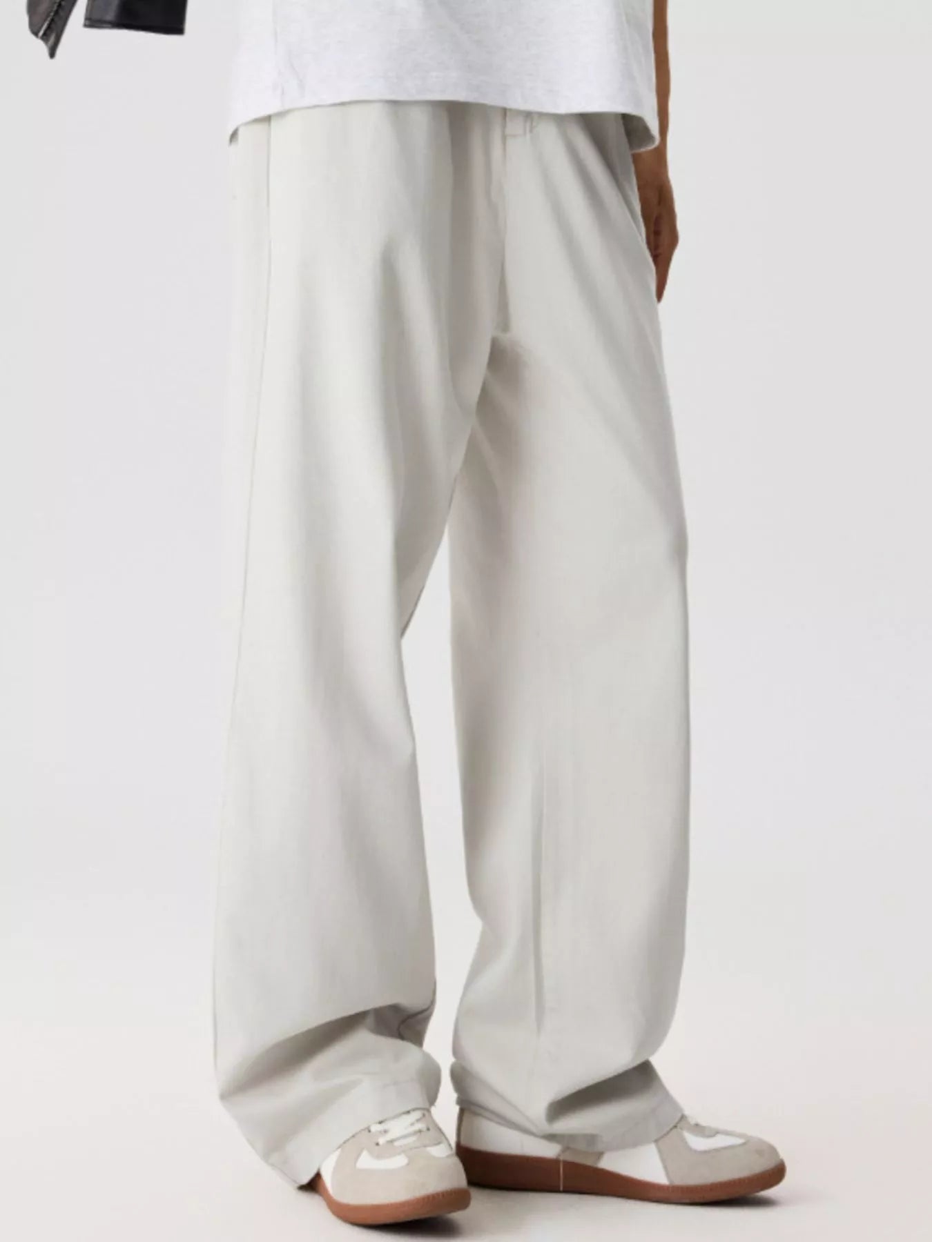 Men's relaxed fit pants with a drawstring waist and pockets.