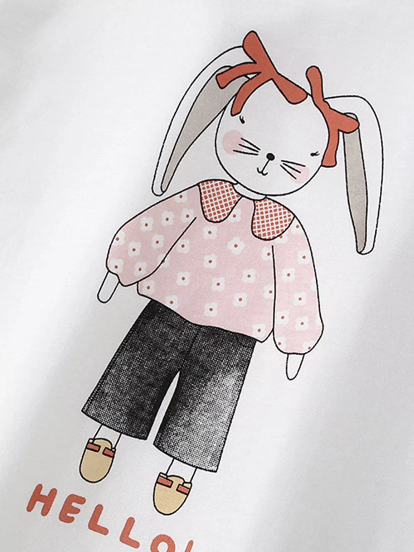 Angled close-up of bunny graphic in pink floral top on white children's short sleeve t-shirt