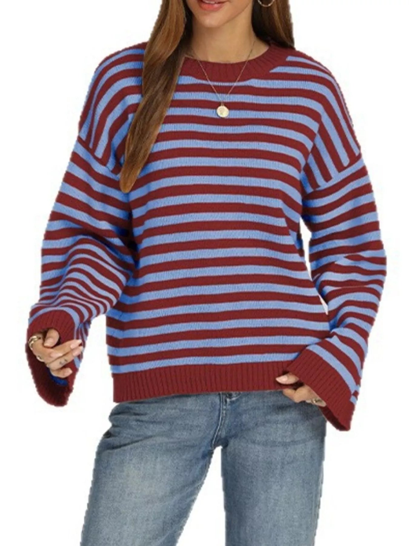 Front view of the red and blue striped sweater with dropped shoulders, long sleeves, and ribbed hem.