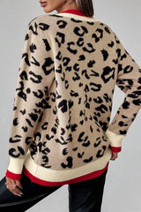 Back view of beige leopard print knit sweater with red and cream ribbed trim.