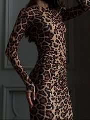 Close side view of the leopard print long sleeve bodycon midi dress showing ruched waist detail
