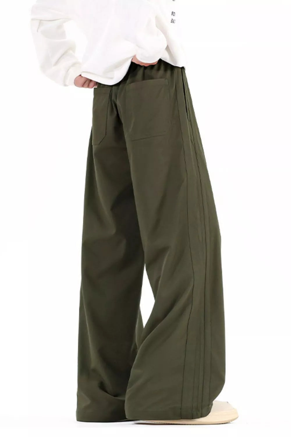 Men's wide leg casual pants with a drawstring waist and pockets.