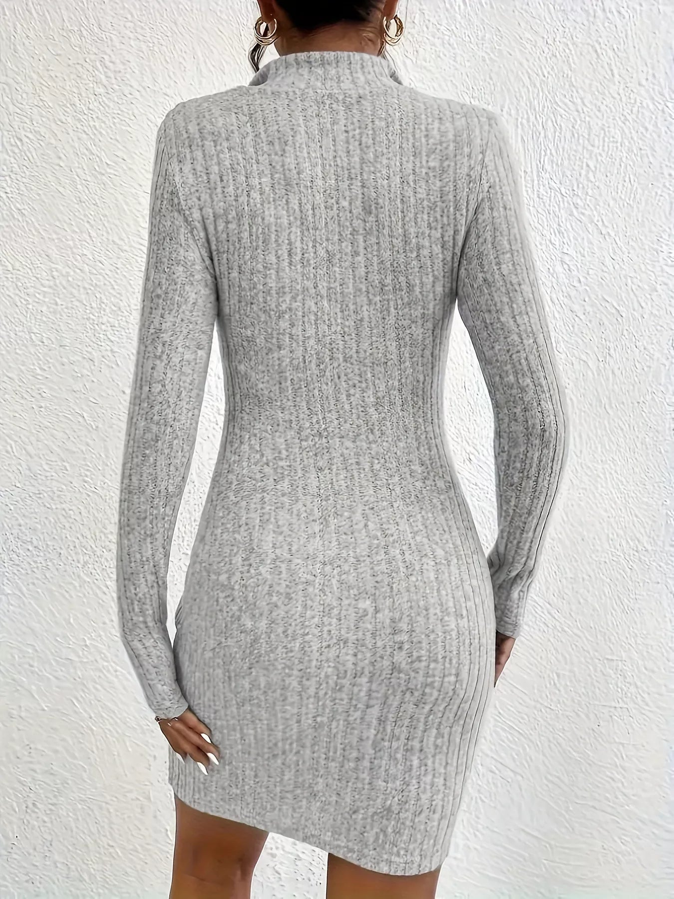 Back view of gray ribbed knit bodycon mini dress with long sleeves