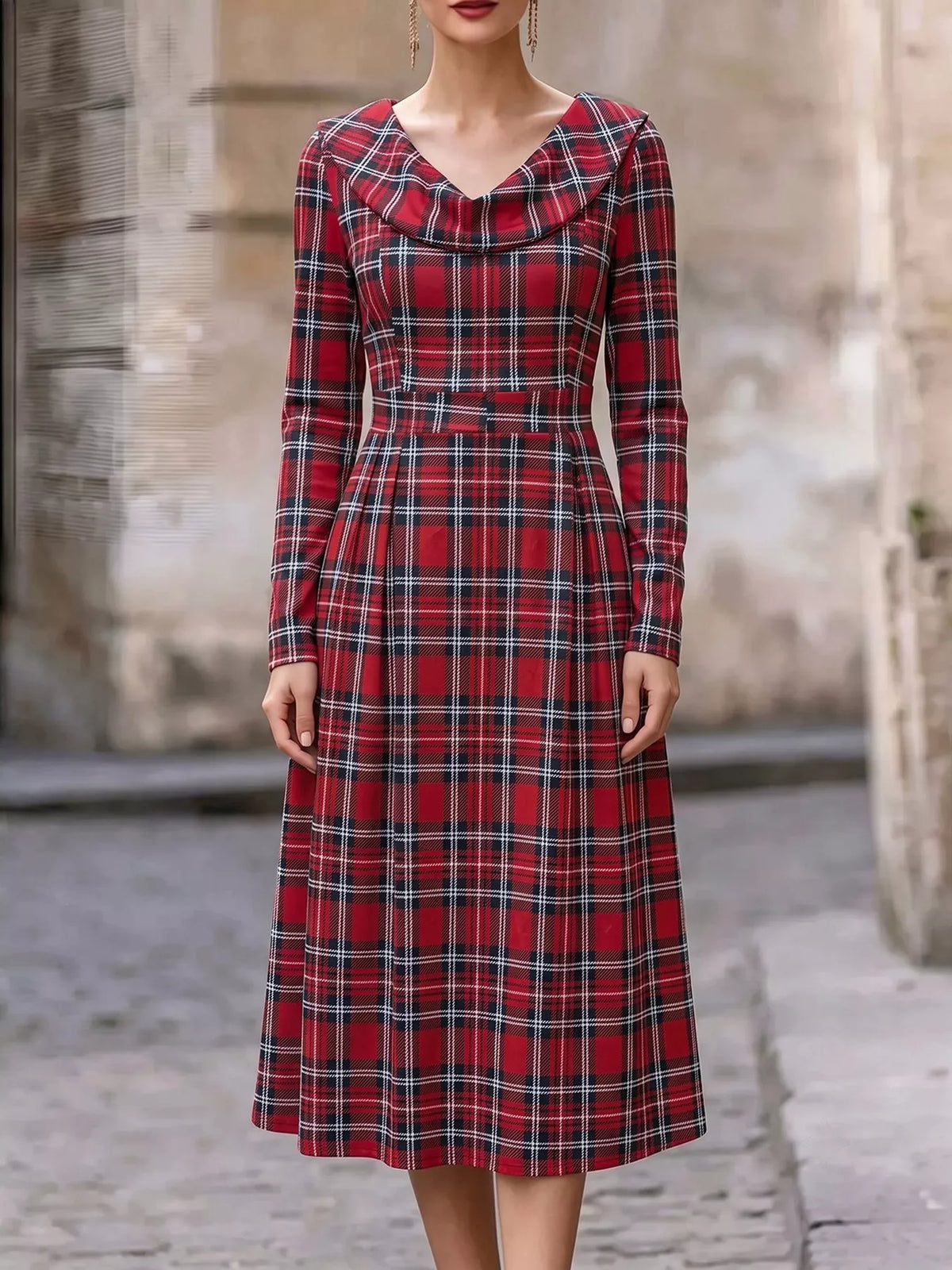 Model wearing burgundy plaid long sleeve midi dress outdoors, front view with cowl neckline and fitted waist