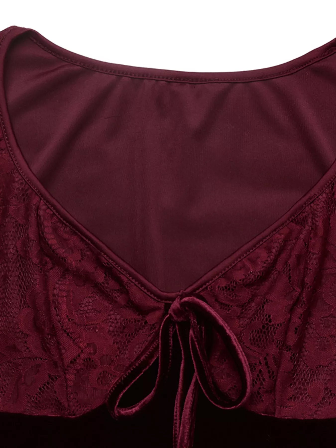 Detail view of burgundy lace bodice with front tie and lined neckline