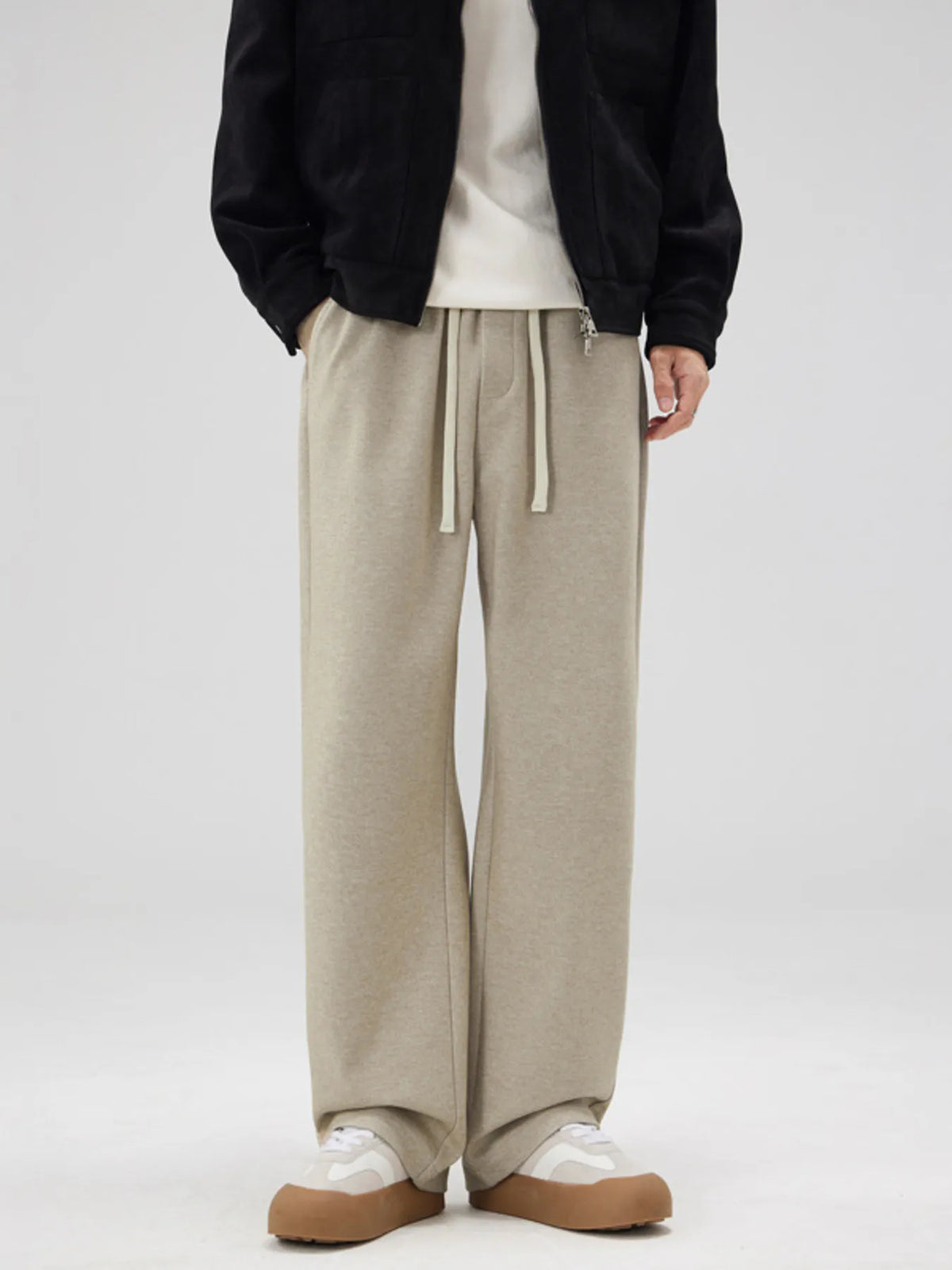 Men's apricot pants with a relaxed fit and drawstring waist.