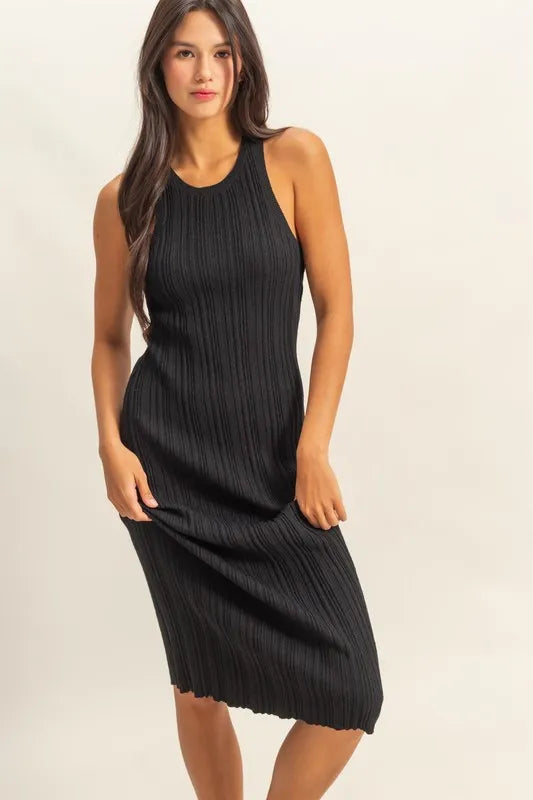 Black sleeveless ribbed knit bodycon dress with round neck, front view on model