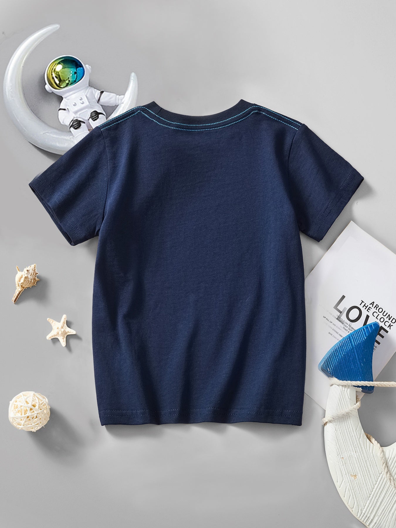 Plain back view of the dark navy children's short sleeve t-shirt laid flat