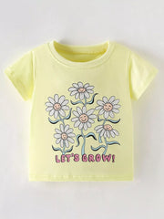 Flat front view of a light yellow children's tee with smiling daisies and pink lettering below