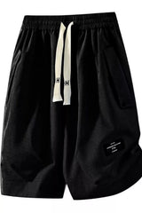 Men's black lightweight shorts with a drawstring waist and pockets.