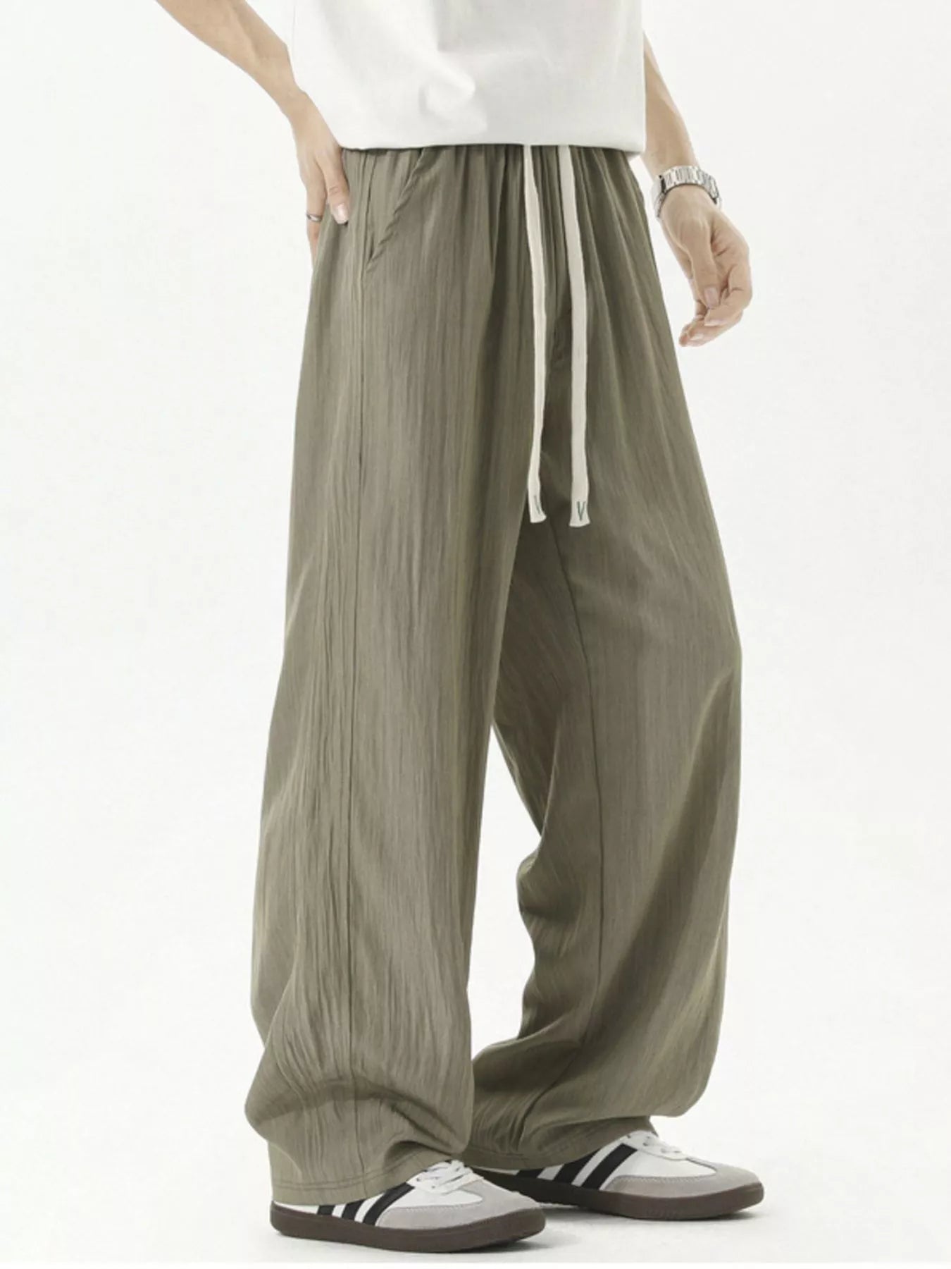 Men's lightweight loose fit casual pants with a drawstring waist.