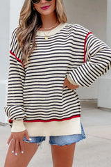 On-model front view of the striped oversized sweater with red shoulder seams and ribbed trim