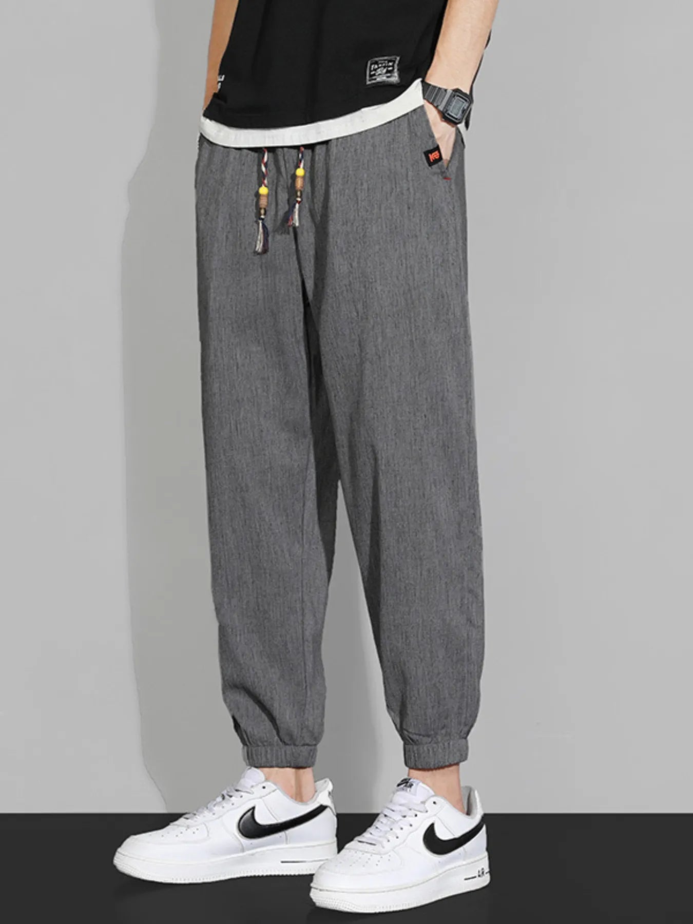 Men's dark gray casual joggers with a drawstring waist, available in plus sizes.