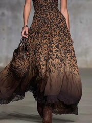 Lower view of the dark brown leopard print maxi skirt with tiered layers and dark lace hem