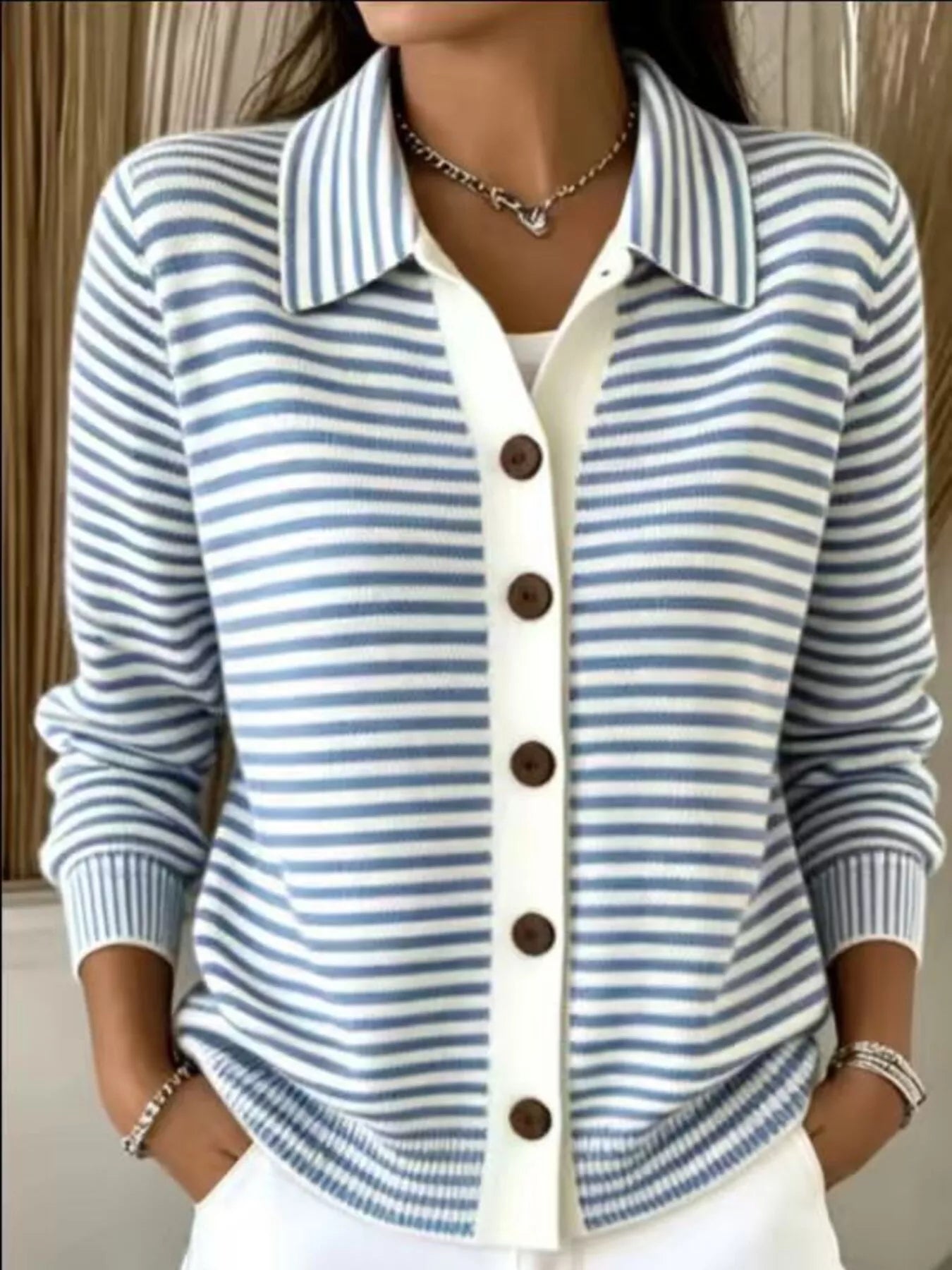 On-model front view of sky blue and white striped collared cardigan with brown buttons