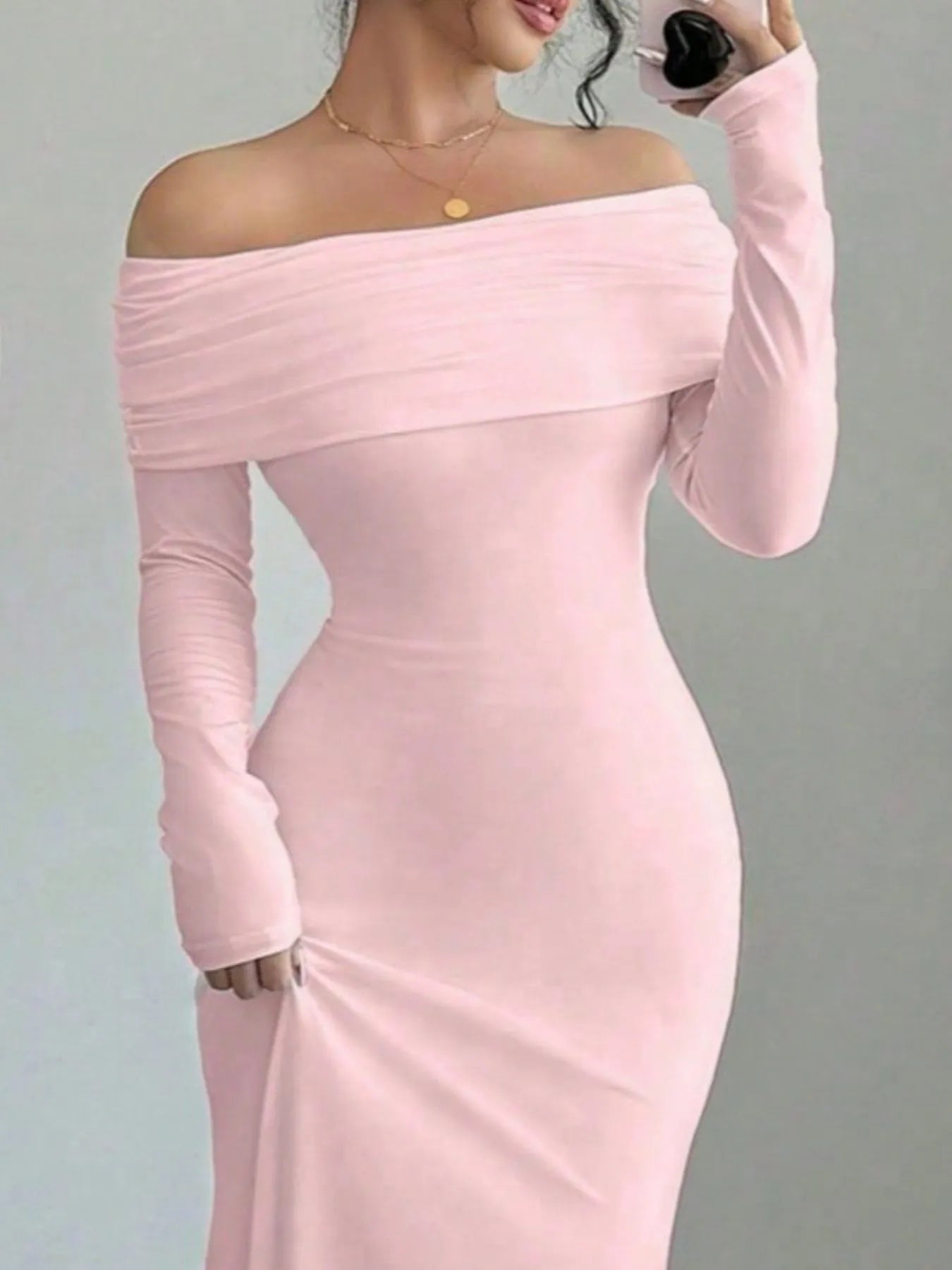 Close front view of pink off shoulder bodycon maxi dress with draped neckline