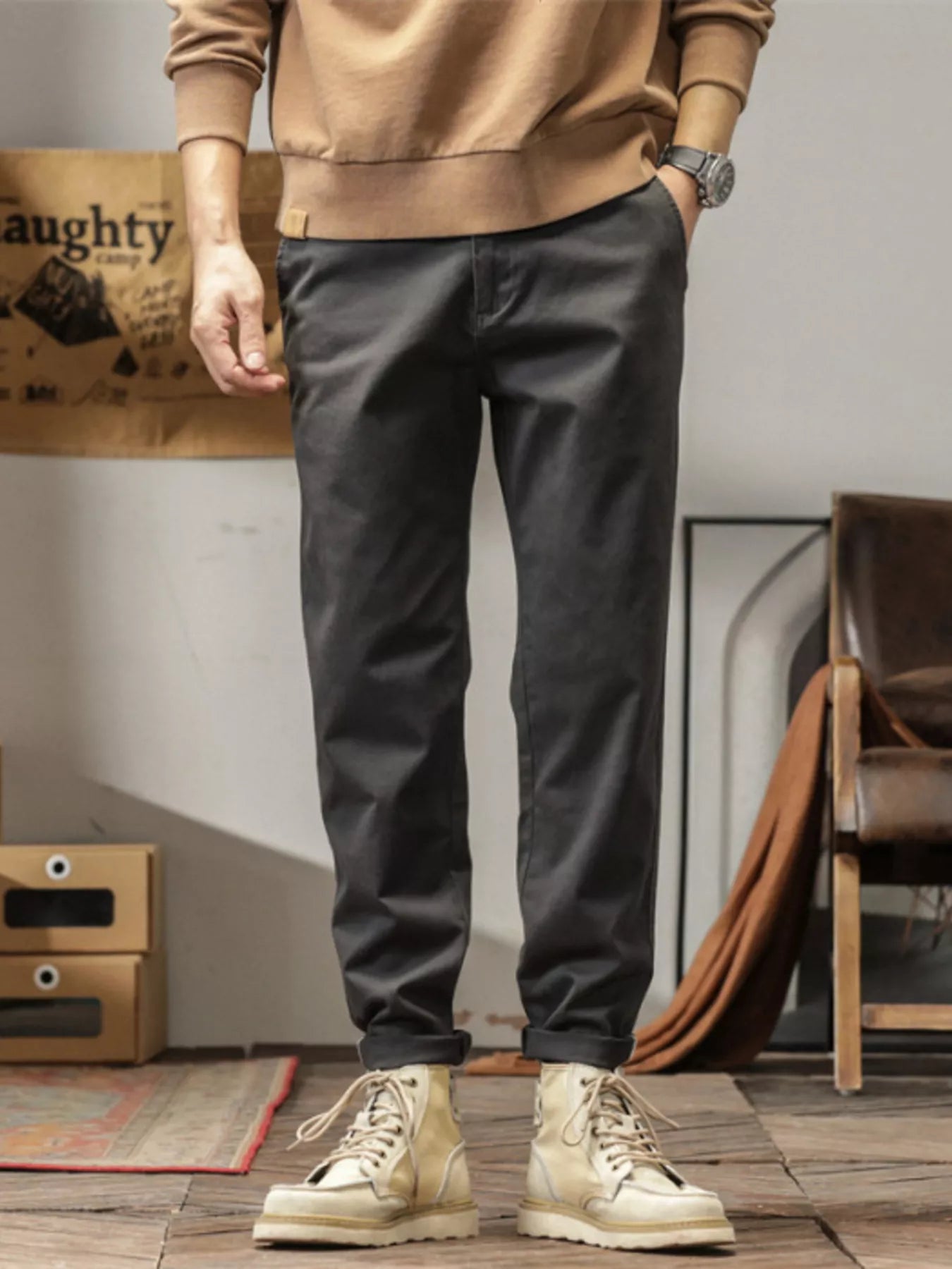 Men's slim fit casual pants with banded ankles and pockets.
