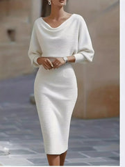 Front view of a white cowl neck knit bodycon dress with wide batwing sleeves