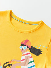Angled close-up of yellow children's t-shirt collar and cyclist graphic upper detail