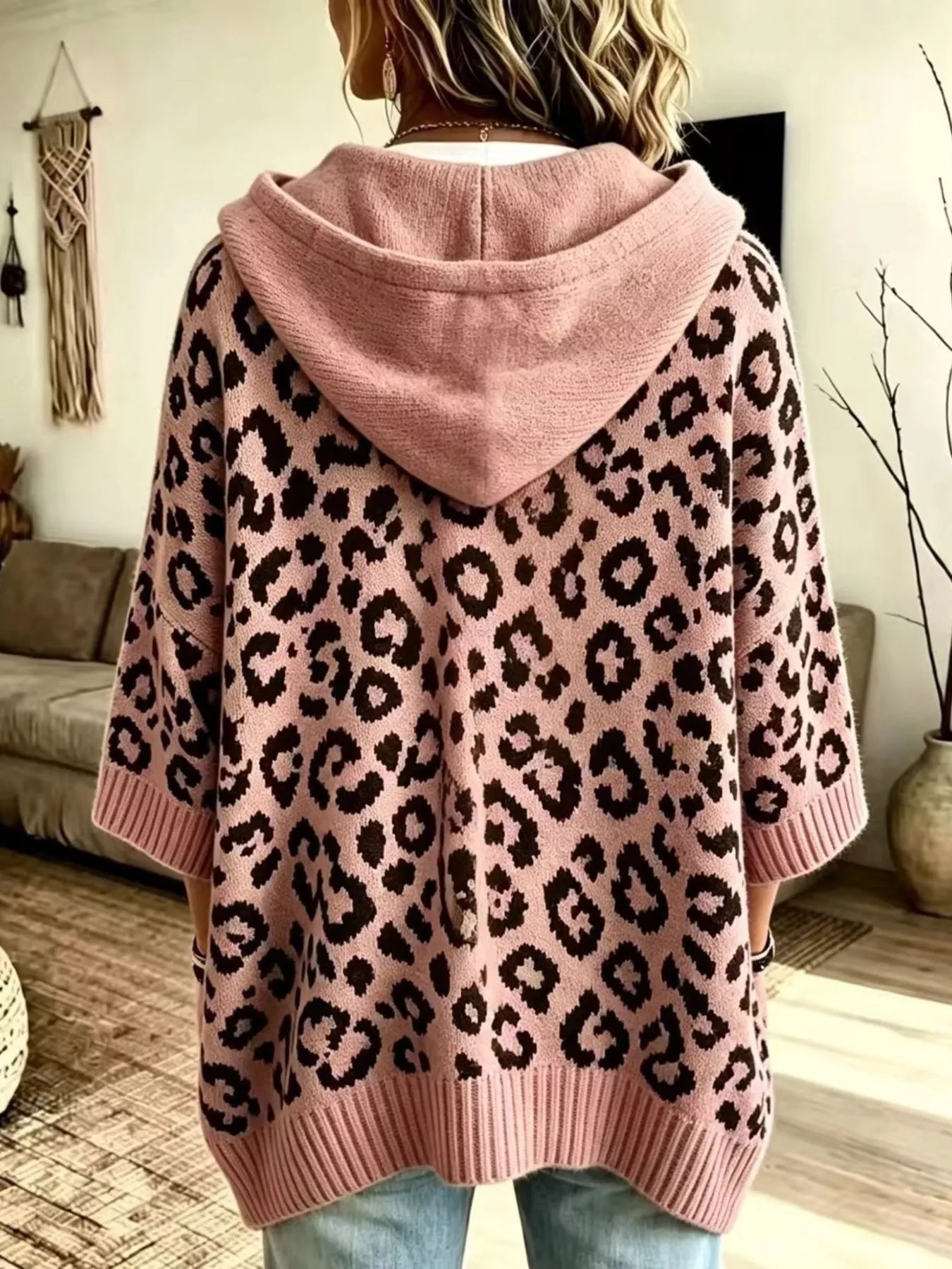 Back view of pink leopard print oversized hooded knit sweater with solid pink hood