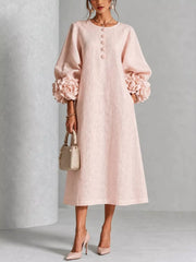 Watermelon pink round neck midi dress with balloon sleeves, floral cuffs and small floral buttons, front view