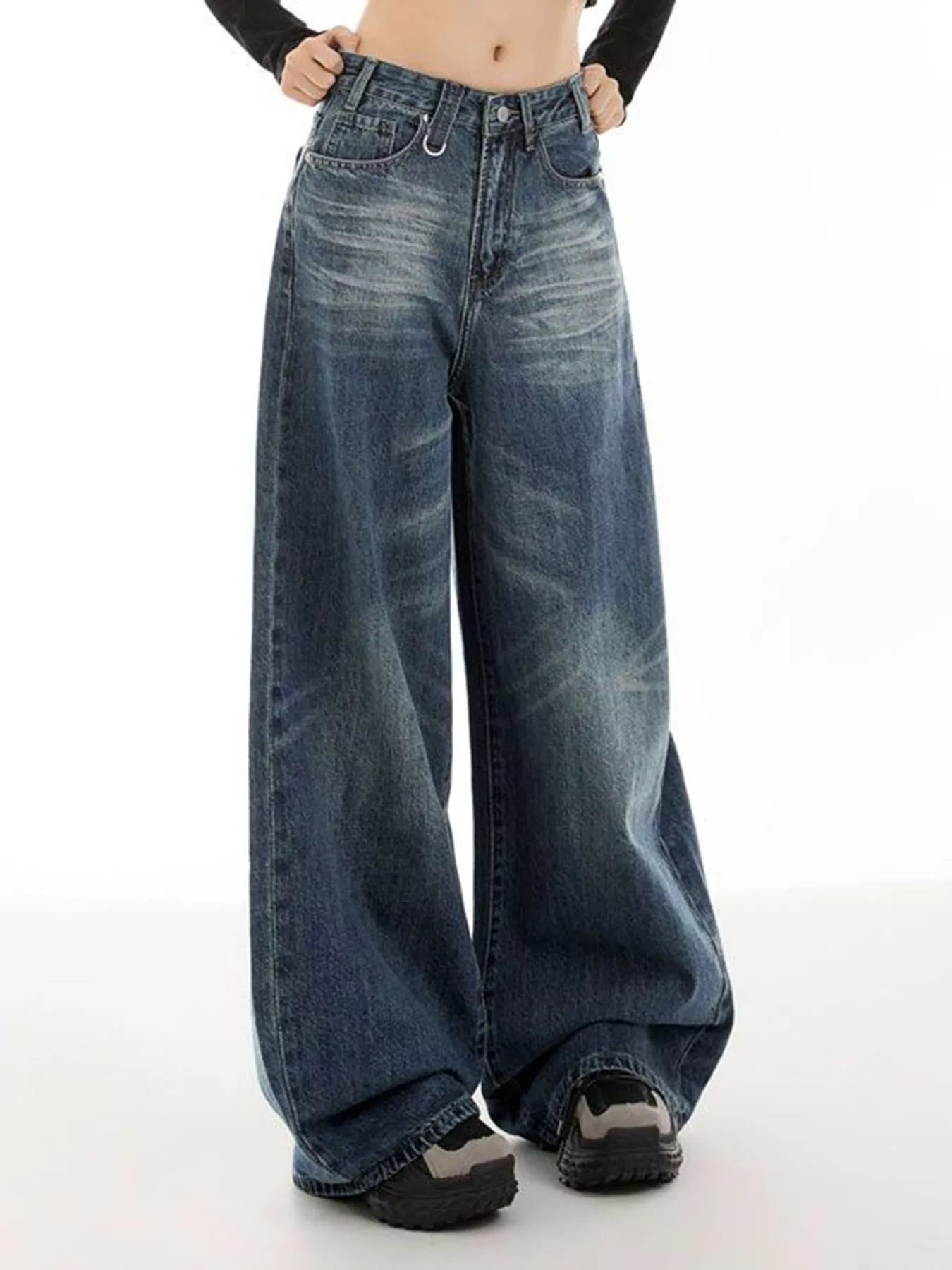 Women's vintage blue wide-leg jeans with washed detailing and pockets.
