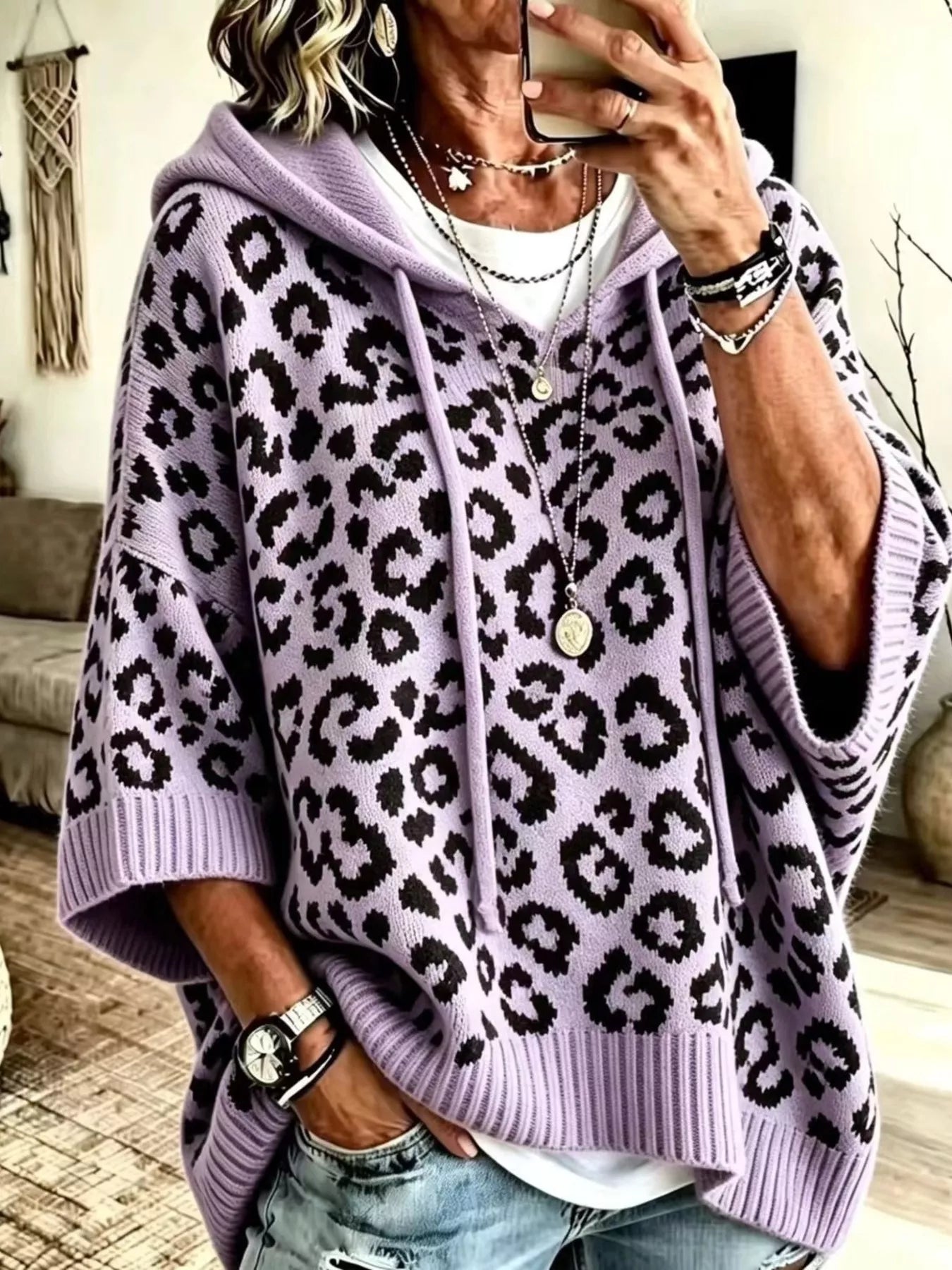 Lavender leopard print oversized hooded knit sweater with black spots, front view