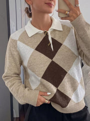 Mirror selfie front view of the argyle polo sweater with a white collar and buttons