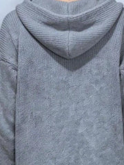 Back view showing the gray knit hood and soft textured fabric