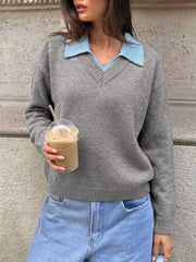 Front view of a gray knit sweater with a light blue polo collar and V neck