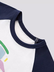 Close up of the navy round neckline and raglan seam on the white T-shirt