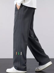 Men's casual loose fit pants with a drawstring waist and pockets.