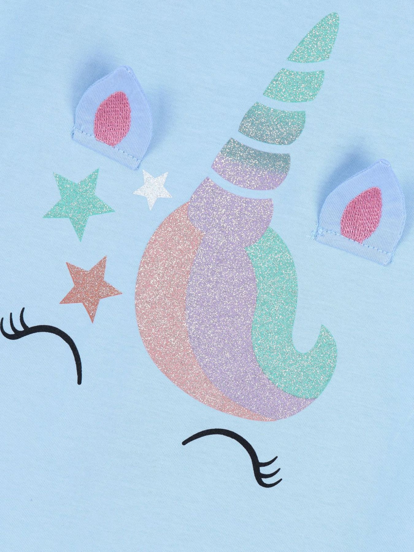 Close-up detail of the glitter unicorn horn, ears and stars on the sky blue tee