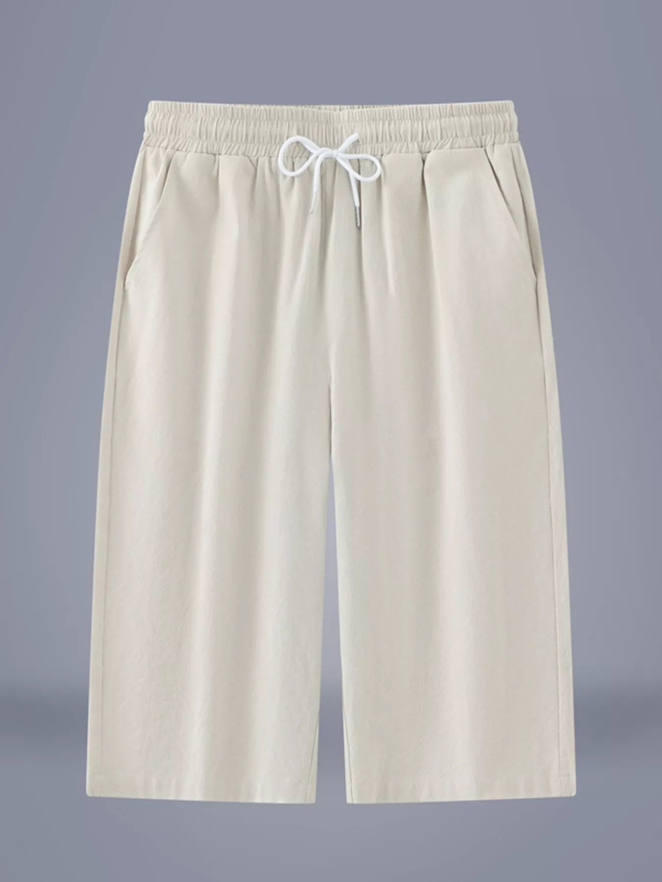 Men's ivory cropped casual pants with a drawstring waist and pockets.