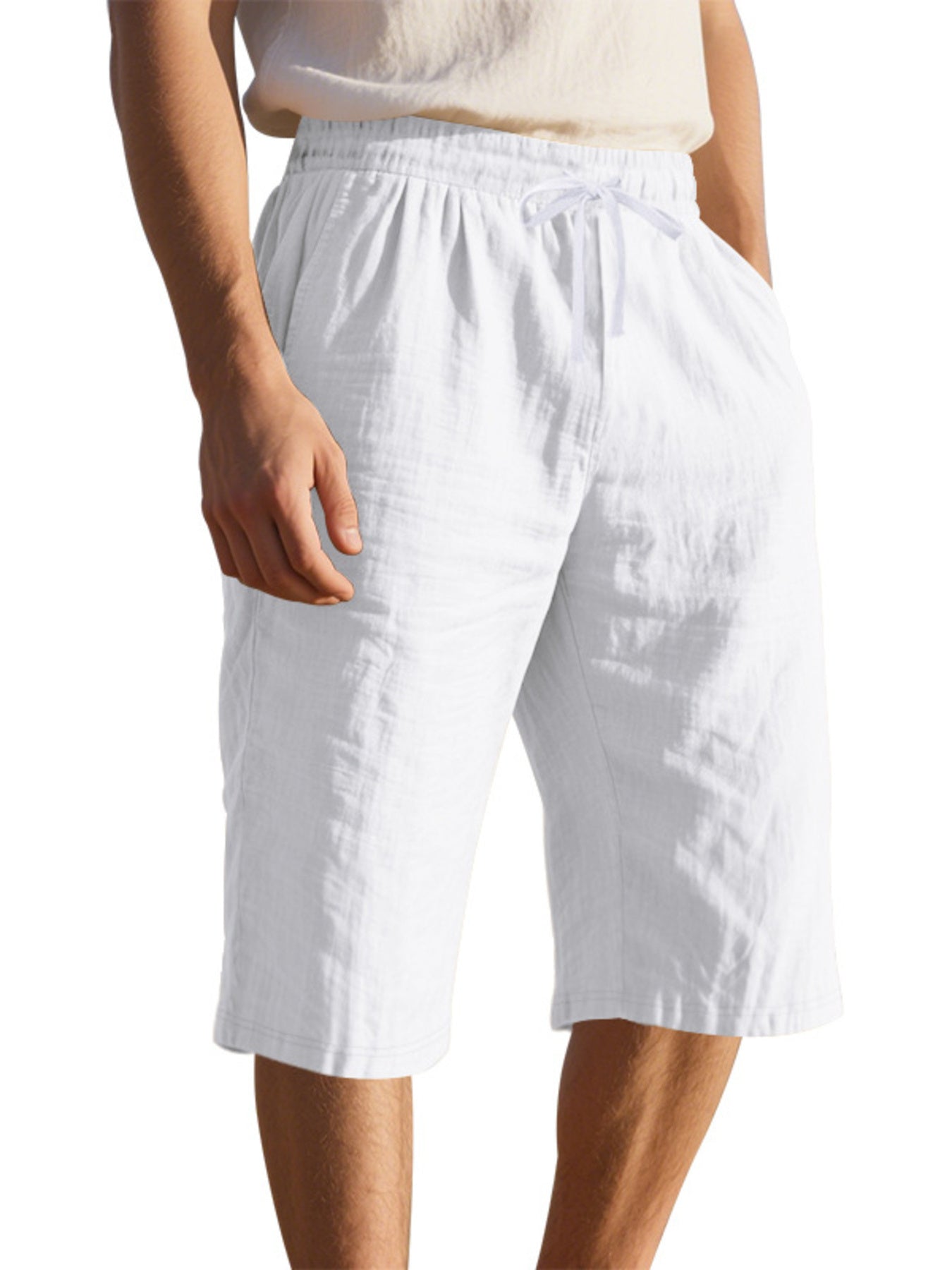Men's casual shorts with a drawstring waist and pockets in the white color.