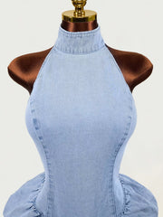 Close up of light blue sleeveless mock neck ruched bodycon denim dress bodice on mannequin