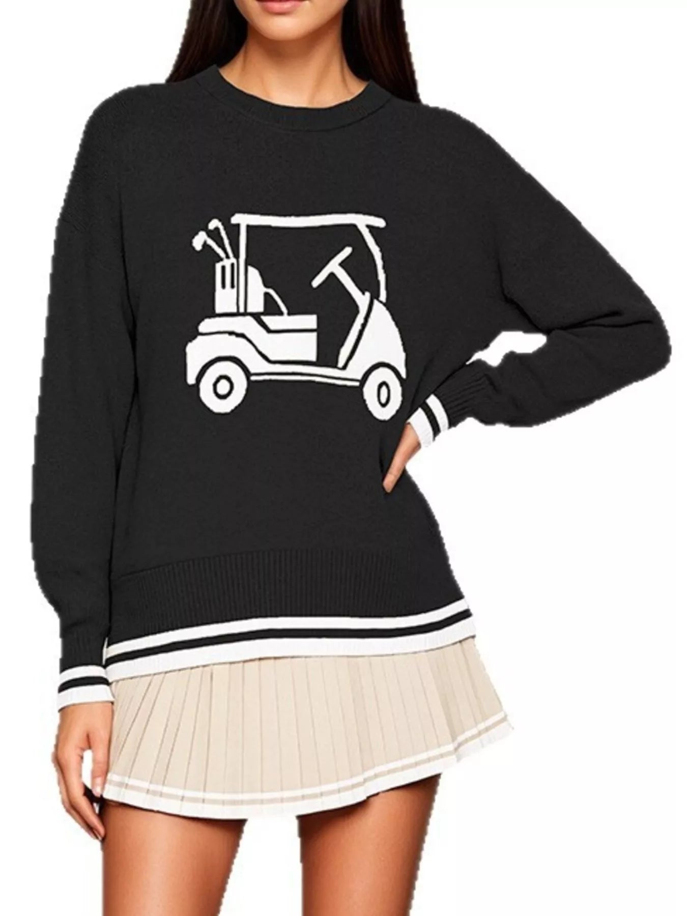 Front view of the black dropped shoulder sweater with a white golf cart graphic, hand on hip.