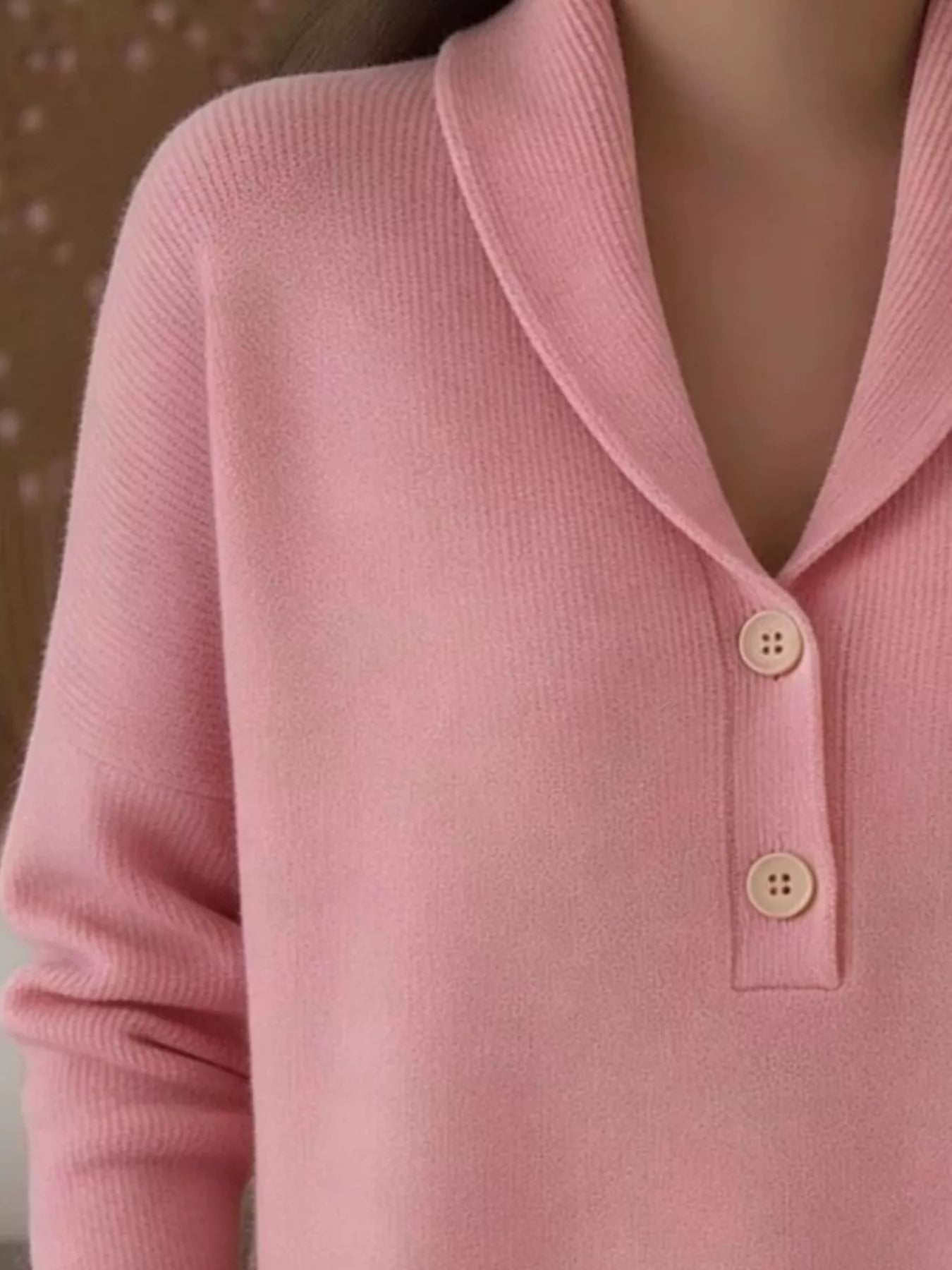 Closer on-model front view of the pink shawl collar sweater with button placket