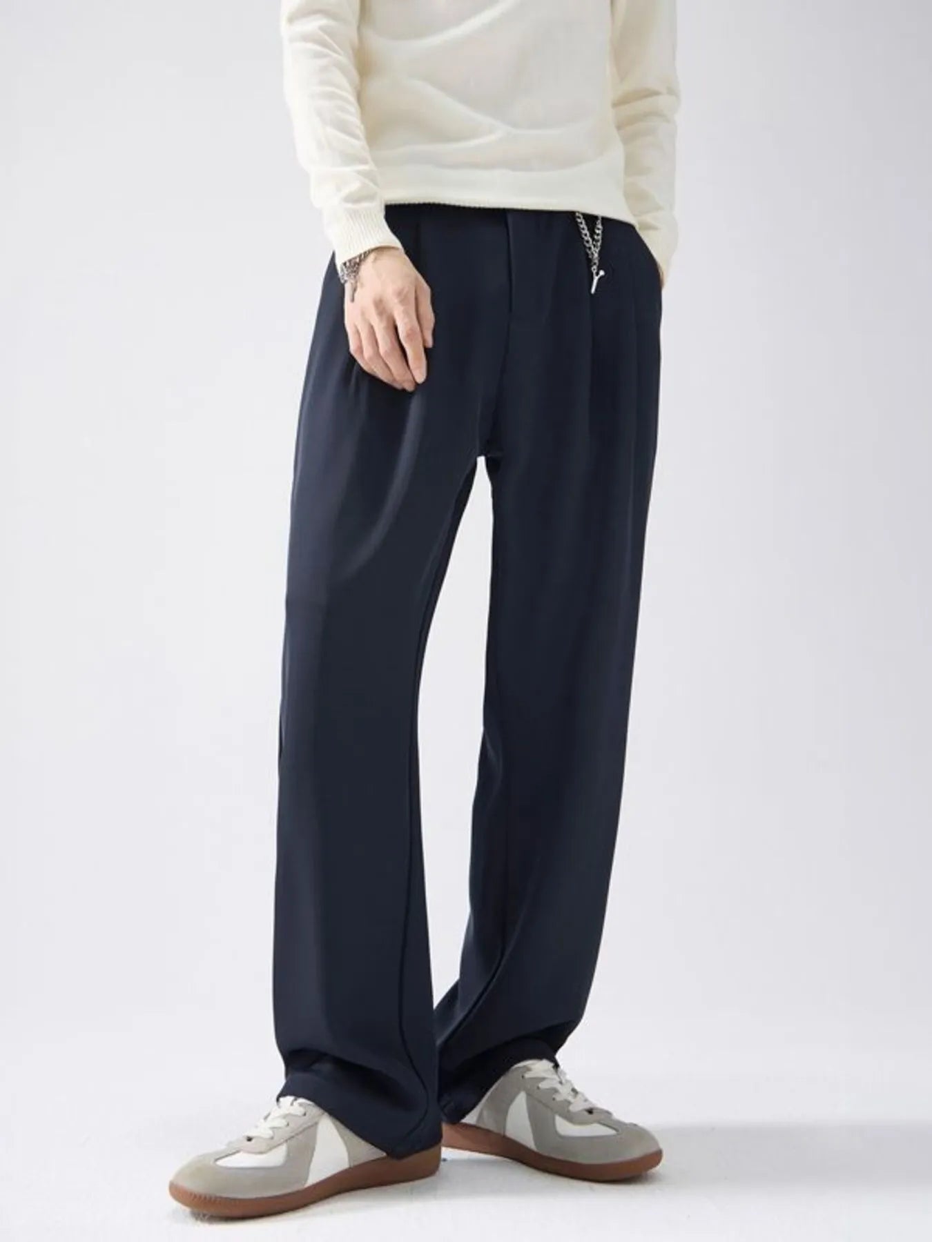 Men's wide leg pants with a drawstring waist and pockets.