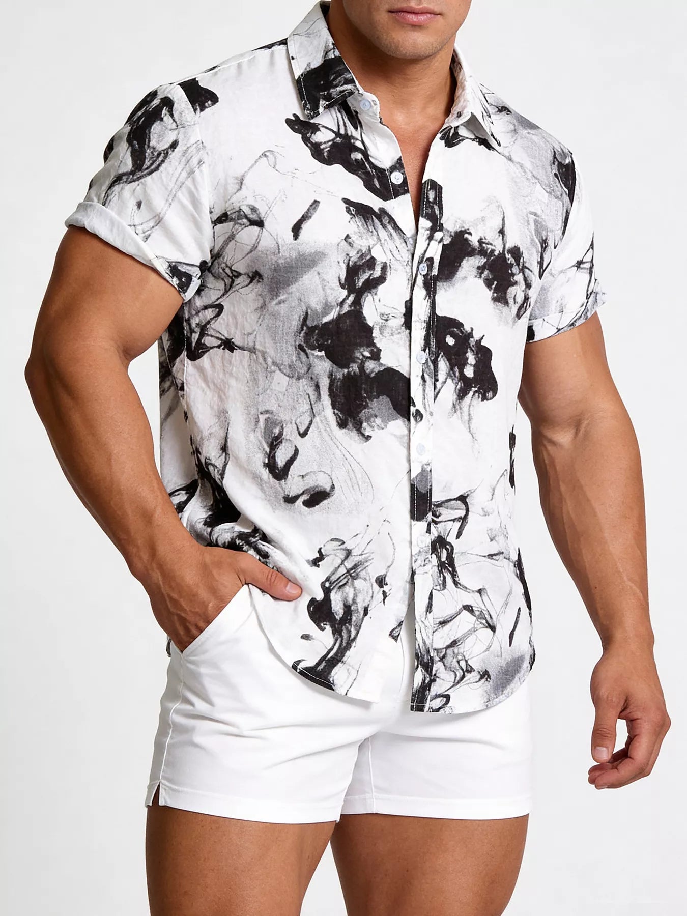 Men's short-sleeve buttoned shirt with an abstract ink-splash print.