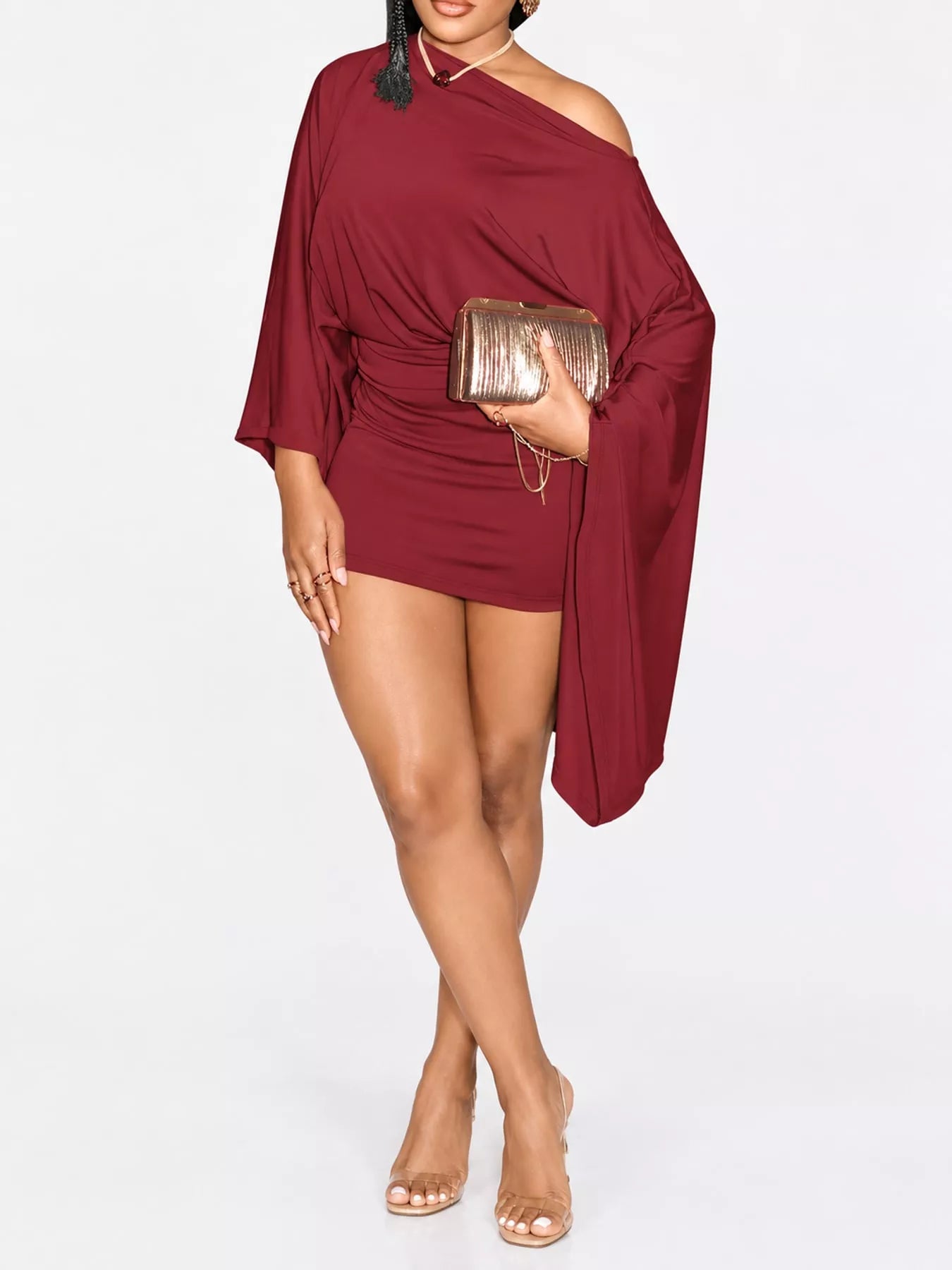 Red one shoulder draped bodycon mini dress, front studio view with gold clutch