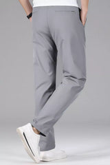 Men's slim-fit stretch dress pants with pockets.