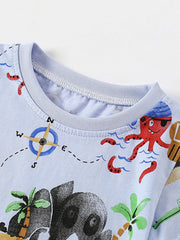 Close-up of the light blue shirt neckline with a compass print and red octopus nearby