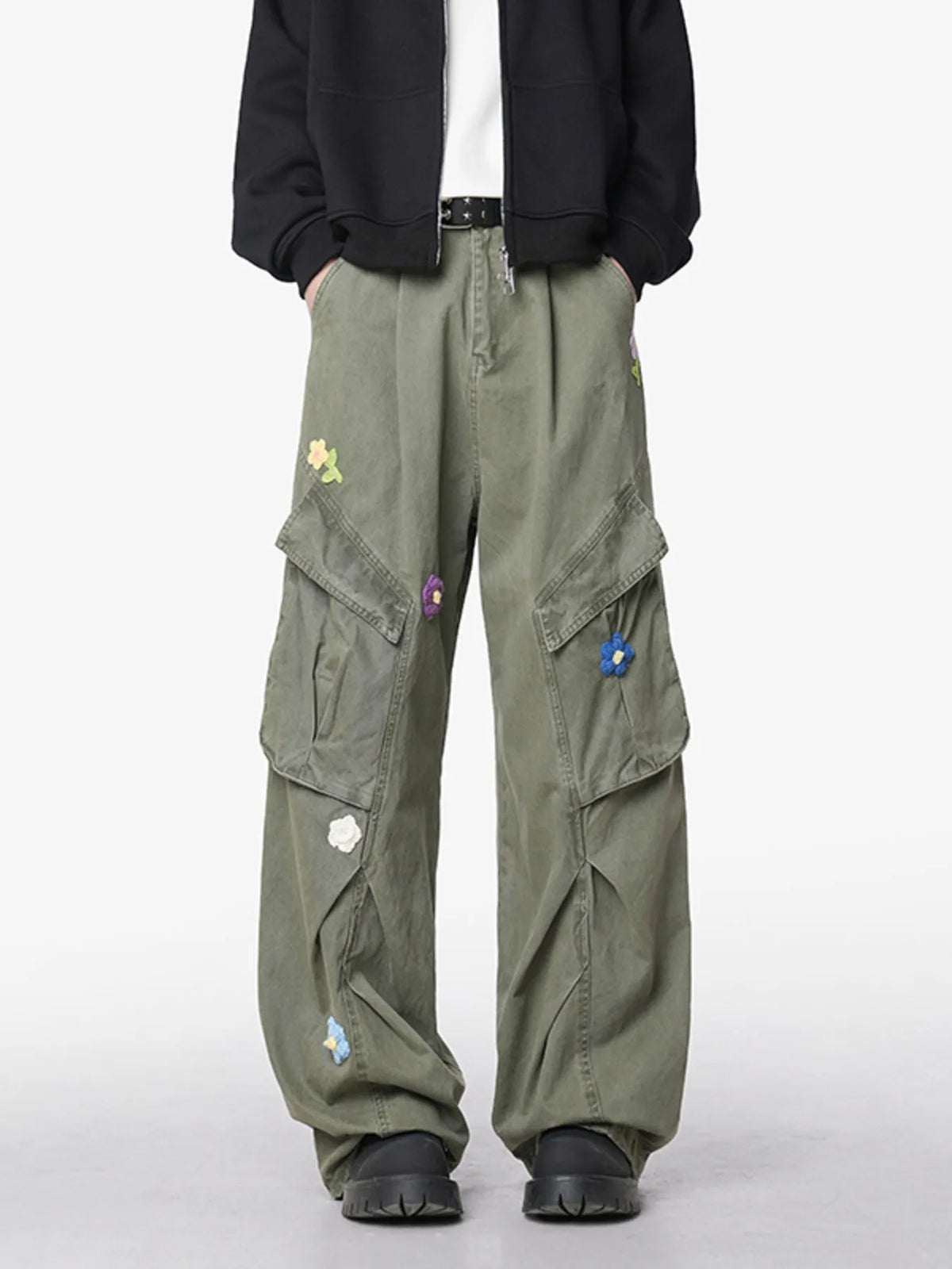 Men's green wide-leg pants with an oversized fit and pockets.